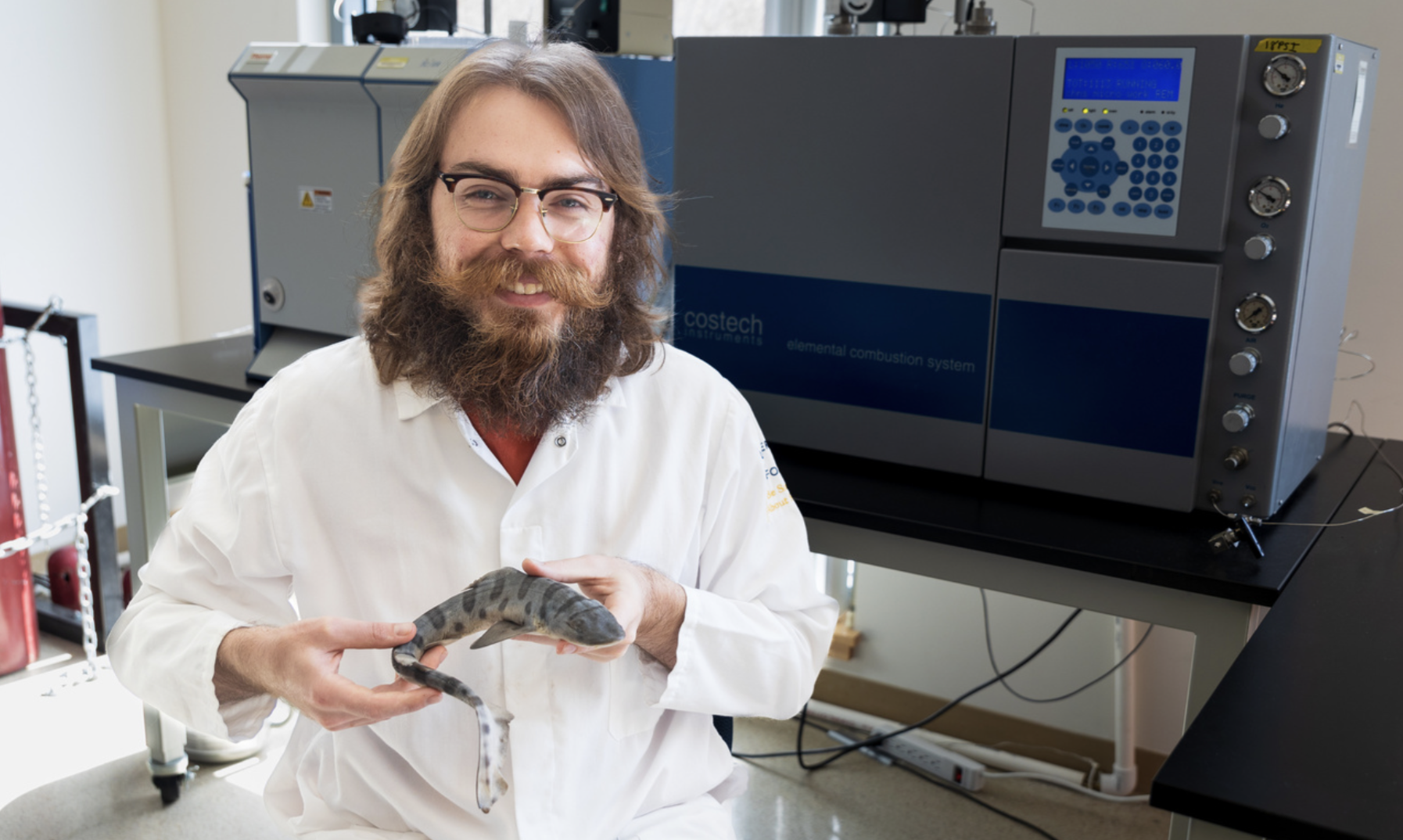 Scientist holding a fish